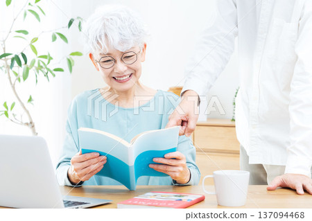 Senior woman planning a trip Senior woman planning a trip 137094468