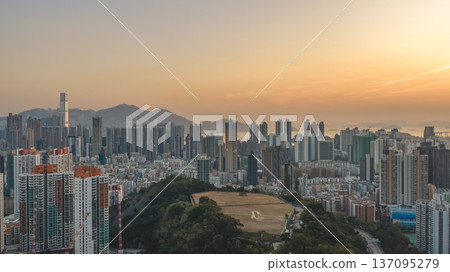 Golden Sunset Over Kowloon Expansive Urban Skyline Feb 13 2026 137095279