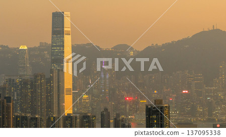 Golden West Kowloon Skyline Framed by Towering Architecture Feb 13 2026 137095338