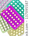 Collection of hormonal birth control pills in different colors and packaging. 137095587