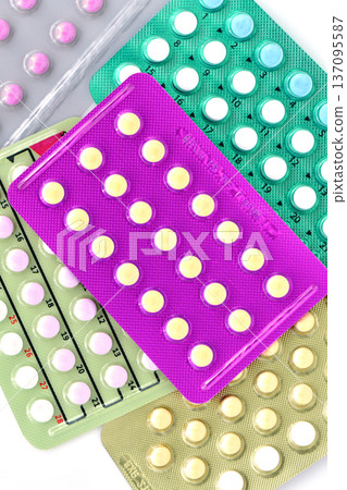 Collection of hormonal birth control pills in different colors and packaging. Collection of hormonal birth control pills in different colors and packaging. 137095587