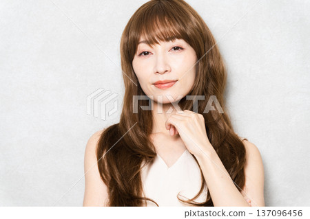 Posing long-haired woman beauty image 137096456