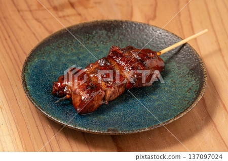 Pork skewers: A classic izakaya dish, grilled to perfection over charcoal 137097024