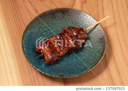 Pork skewers: A classic izakaya dish, grilled to perfection over charcoal 137097025