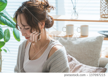 Profile of a woman wearing accessories, earrings, and earrings 137097215