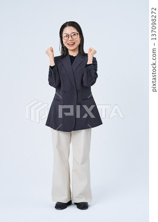 A young businesswoman posing in support A young businesswoman posing in support 137098272