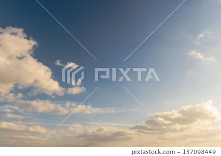 Winter evening blue sky and sparkling fluffy white clouds 55 137098449