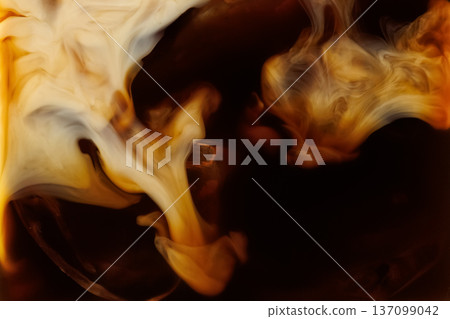 Macro shot of milk mixing into coffee with ice Macro shot of milk mixing into coffee with ice 137099042