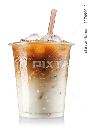 Iced latte with milk in fogged disposable plastic cup with straw isolated on white background 137099045