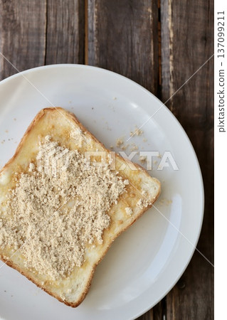 Unsweetened kinako butter toast made with a square-shaped pain de mie for intestinal health Unsweetened kinako butter toast made with a square-shaped pain de mie for intestinal health 137099211
