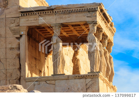 The Caryatid porch of Erechtheion (Erechtheum) or Temple of Athena Polias is an ancient Greek Ionic temple on the north side of the Acropolis in Athens, Greece The Caryatid porch of Erechtheion (Erechtheum) or Temple of Athena Polias is an ancient Greek Ionic temple on the north side of the Acropolis in Athens, Greece 137099817