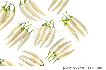 Fresh white chili peppers with green stems arranged in groups, isolated on a white background. Concept of spicy food 137100805