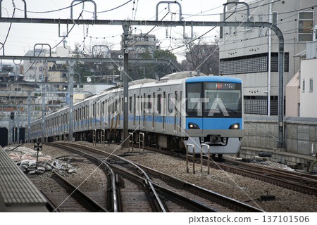A train passing through Umegaoka Station on the Odakyu Line A train passing through Umegaoka Station on the Odakyu Line 137101506