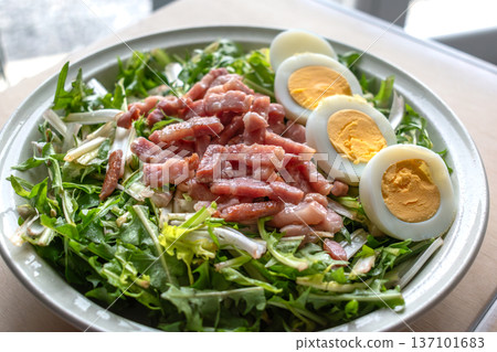 Dandelion salad with hard boiled eggs and bacon, diuretic, vitamin, healthy food Dandelion salad with hard boiled eggs and bacon, diuretic, vitamin, healthy food 137101683