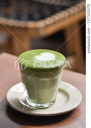 green tea or matcha latte , matcha green tea latte , milk green tea green tea or matcha latte , matcha green tea latte , milk green tea 137102079