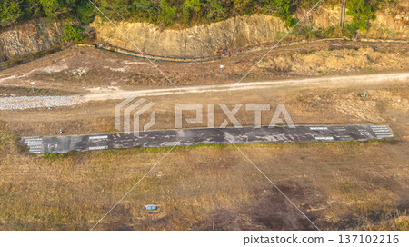 Remote Hillside Runway Stretching Across Grassy Sheung Lau Wan Feb 22 2026 Remote Hillside Runway Stretching Across Grassy Sheung Lau Wan Feb 22 2026 137102216