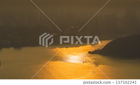 Golden Sunset Reflections Shimmer Beside Lei Yue Mun Coastline Feb 22 2026 137102241