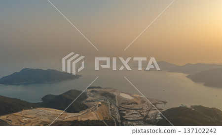 Golden Hazy Sunset Over Expansive Fat Tong O Coastline Feb 22 2026 137102242