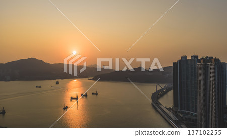 Warm Sunset Reflections Glow Across Tranquil Junk Bay Waters Feb 22 2026 137102255