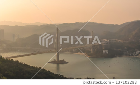 Cable Stayed Bridge Glowing Under Sunset Across Calm Waters Feb 21 2026 Cable Stayed Bridge Glowing Under Sunset Across Calm Waters Feb 21 2026 137102288