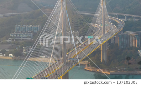 Cable Stayed Bridge Glowing Under Sunset Across Calm Waters Feb 21 2026 137102305