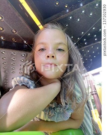 Girl having fun in theme park. Happy theme. Nature ambient. Having fun. Smiley faces. Climbing the ladder. the baby slides on the slide. playing with other children. High quality photo Girl having fun in theme park. Happy theme. Nature ambient. Having fun. Smiley faces. Climbing the ladder. the baby slides on the slide. playing with other children. High quality photo 137102930