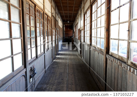 The interior of a retro wooden school building from a former elementary school on display at the roadside station 137103227