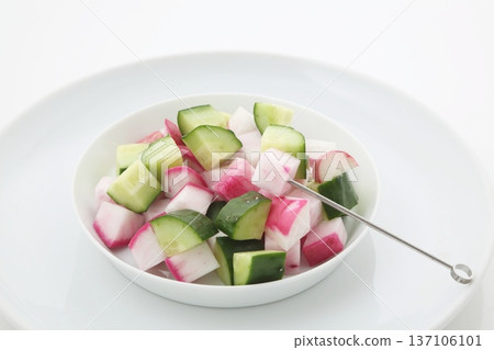 Cut red turnips, red radishes, cucumbers and picks 137106101