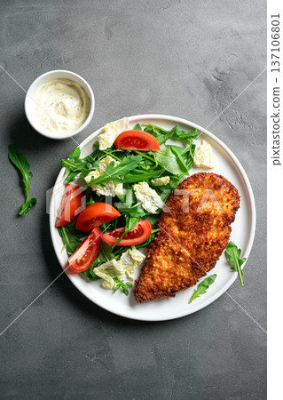 Breaded Chicken with vegetable salad Breaded Chicken with vegetable salad 137106801