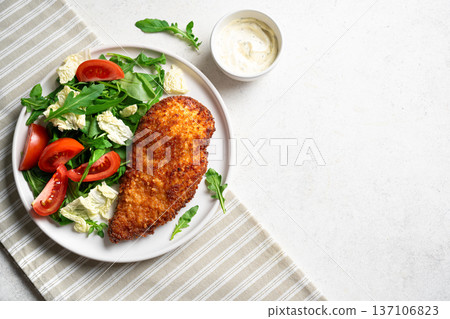 Breaded Chicken with vegetable salad Breaded Chicken with vegetable salad 137106823