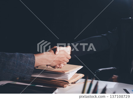 Professional photo of a person's hands reviewing a contract or legal document on a desk, for concepts of business, finance, and legal affairs Professional photo of a person's hands reviewing a contract or legal document on a desk, for concepts of business, finance, and legal affairs 137108729