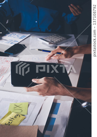 UXUI design brainstorming session with sketches and digital tools 137108792