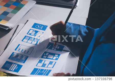 UXUI design brainstorming session with sketches and digital tools 137108796