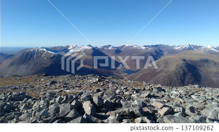 Majestic Mountain Peaks Under a Clear Blue Sky, Awe Inspiring View 137109262