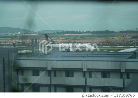 Singapore Airlines Plane on Tarmac at Major Airport Hub 137109760