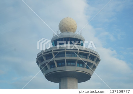 Modern Air Traffic Control Tower with Radome against Blue Sky Modern Air Traffic Control Tower with Radome against Blue Sky 137109777
