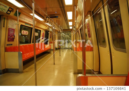 Empty Modern Subway Train Interior with Bright Orange Seats Empty Modern Subway Train Interior with Bright Orange Seats 137109841