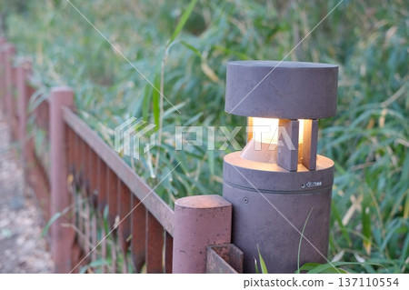 Rusty guardrails and evening lights Rusty guardrails and evening lights 137110554