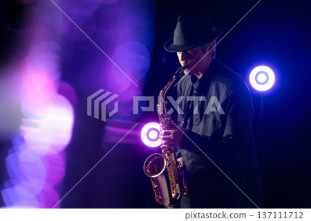 Man playing the saxophone live 137111712