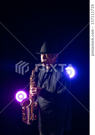 Man playing the saxophone live 137111719