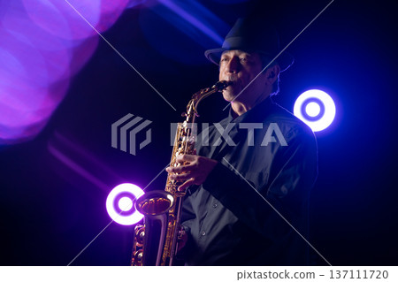 Man playing the saxophone live 137111720