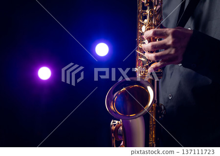 Man playing the saxophone live Man playing the saxophone live 137111723