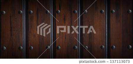 Dark wooden wall panels with metal rivets arranged in a vertical pattern, showcasing rich textures and natural grain, ideal for interior design and architectural applications Dark wooden wall panels with metal rivets arranged in a vertical pattern, showcasing rich textures and natural grain, ideal for interior design and architectural applications 137113073