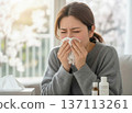 Woman blowing her nose 137113261