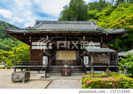 The Kaisan-do Hall of Zenpo-ji Temple in Nishiyama, Kyoto. The tranquil scenery of the temple grounds surrounded by fresh green mountains. The Kaisan-do Hall of Zenpo-ji Temple in Nishiyama, Kyoto. The tranquil scenery of the temple grounds surrounded by fresh green mountains. 137113460