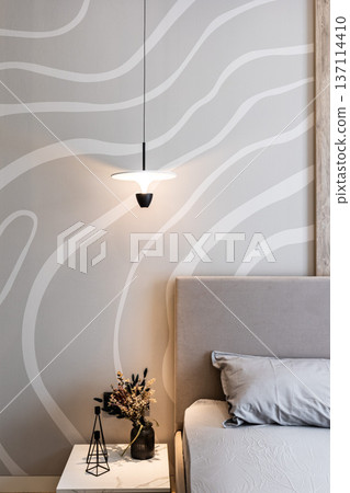 Modern bedroom with pendant lamp and wavy wall Modern bedroom with pendant lamp and wavy wall 137114410
