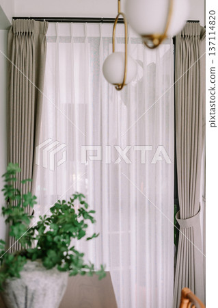 Modern Interior Window with Layered Curtains and Natural Light Modern Interior Window with Layered Curtains and Natural Light 137114820