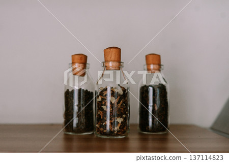 Natural Dry Ingredients in Glass Bottles with Cork Lids Natural Dry Ingredients in Glass Bottles with Cork Lids 137114823