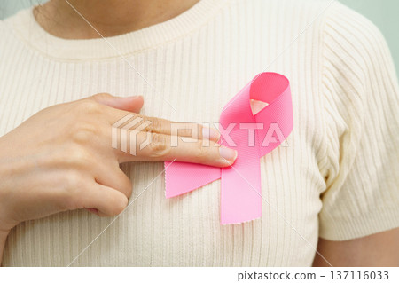 Asian woman with pink ribbon for October world breast cancer day. 137116033
