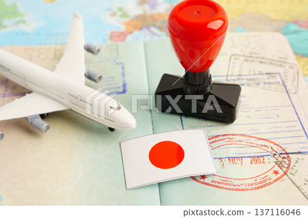 Japan passport with approved stamp on document for tourism to immigration at airport in country. Japan passport with approved stamp on document for tourism to immigration at airport in country. 137116046